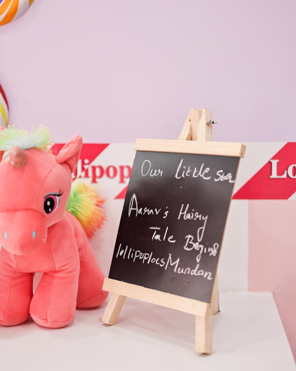 A child playing happily in a ball pit