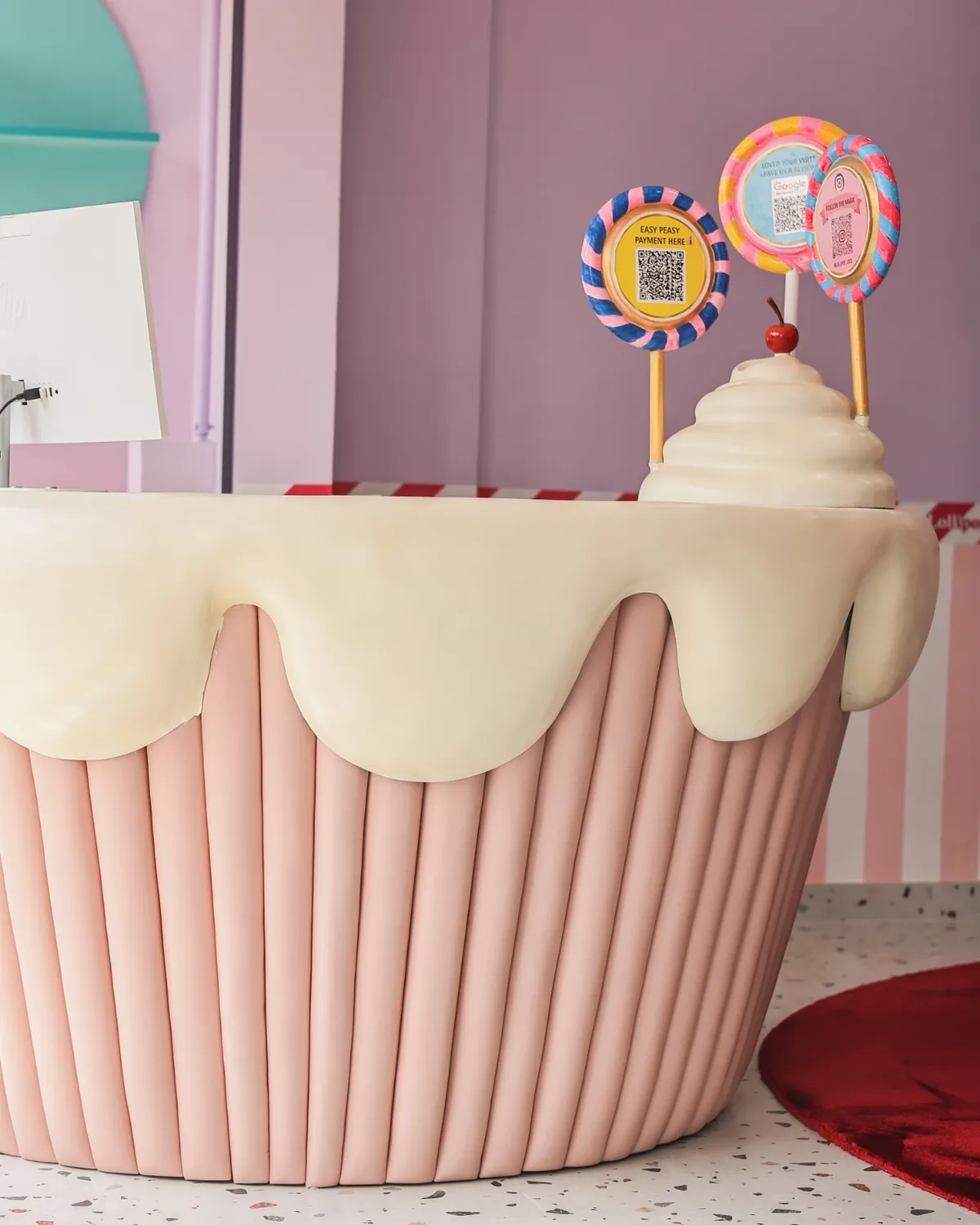Cupcake-shaped reception counter at Lollipop Locs