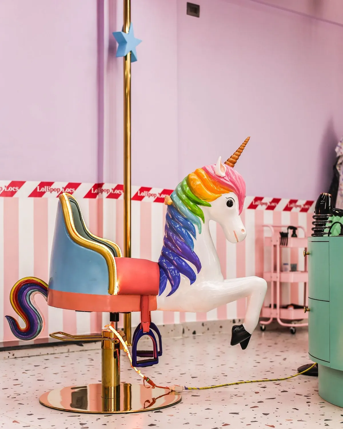 Rainbow unicorn haircut chair at Lollipop Locs